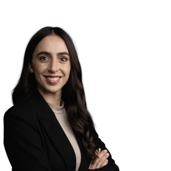 Portrait of a smiling woman with dark hair wearing a black blazer