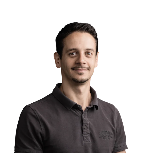 Giuseppe Parisi Portrait of smiling man with dark brown hair wearing a black polo shirt