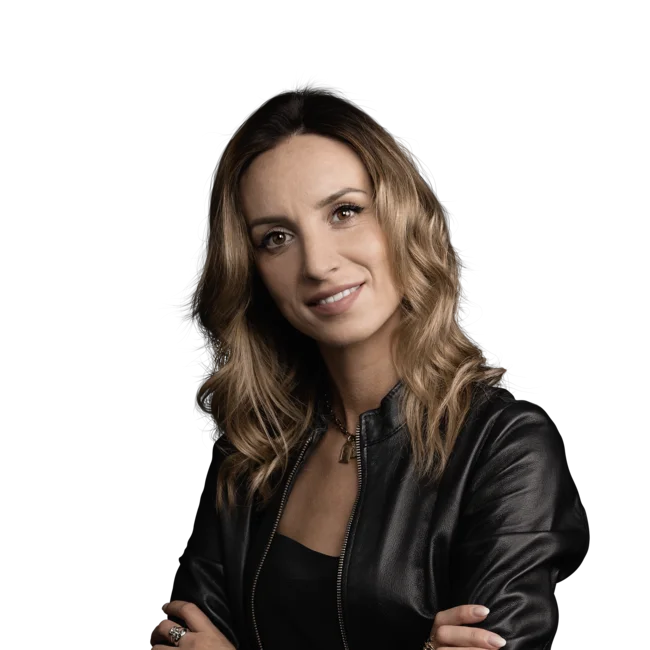 Elisabetta Rossi Woman with wavy hair wearing leather jacket on white background