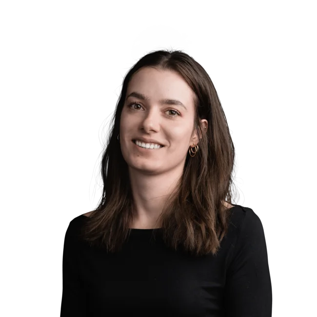Sophie Bachmann Portrait of a smiling young woman with brown hair wearing a black top