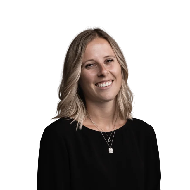 Young woman with medium blonde hair and black top smiling