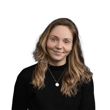 Young woman with long blonde hair and black sweater smiling