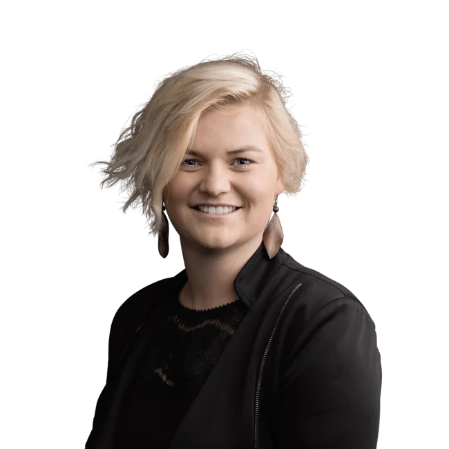 Marion Weissensteiner Smiling blonde woman with short hair wearing black clothing