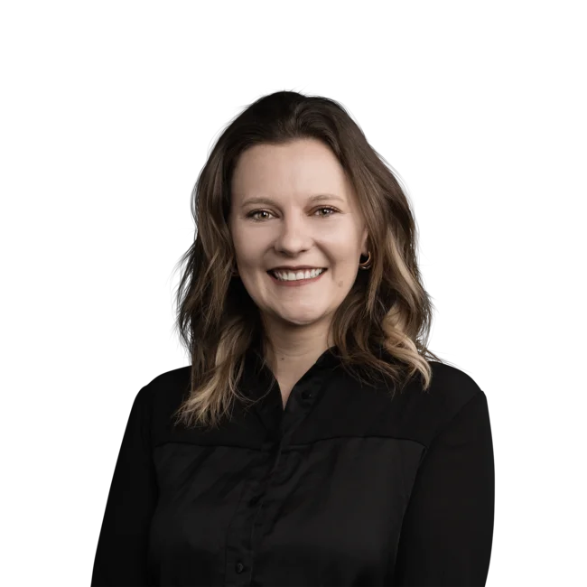 Portrait of a smiling woman with wavy hair wearing a black shirt