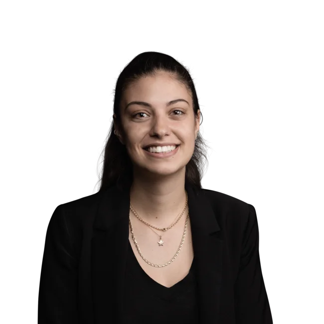 Alessandra Cadamuro Portrait of smiling young woman wearing black blazer and necklaces