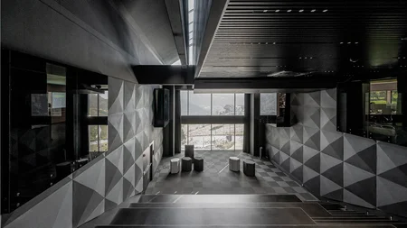 Modern empty conference room with geometric wall patterns and seating